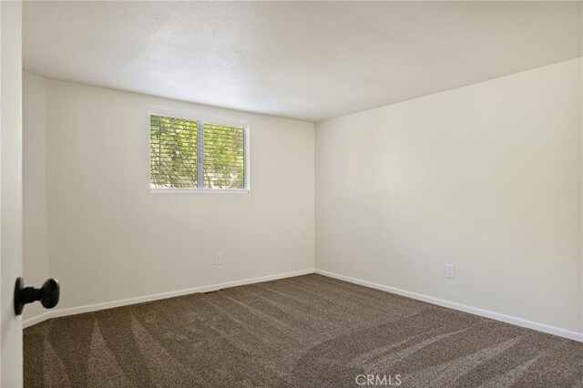32296 Fern Dr, Running Springs, CA 92382 - empty room featuring carpet and baseboards