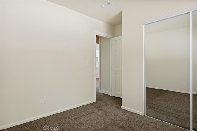 32296 Fern Dr, Running Springs, CA 92382 - unfurnished bedroom featuring carpet flooring, a closet, and baseboards