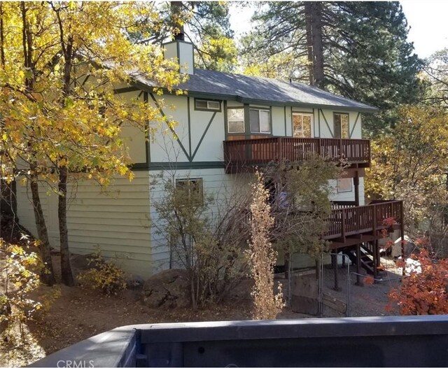 32296 Fern Dr, Running Springs, CA 92382 - back of house featuring a deck and a chimney