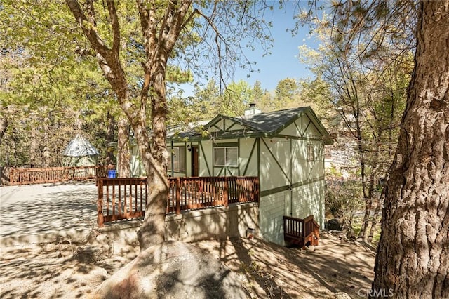 32296 Fern Dr, Running Springs, CA 92382 - exterior space featuring a chimney and a wooden deck