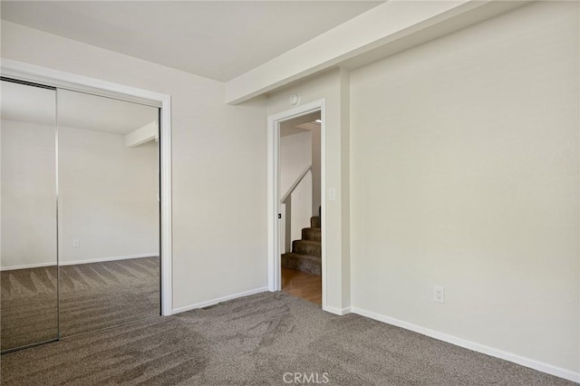 32296 Fern Dr, Running Springs, CA 92382 - unfurnished bedroom with carpet floors, baseboards, and a closet