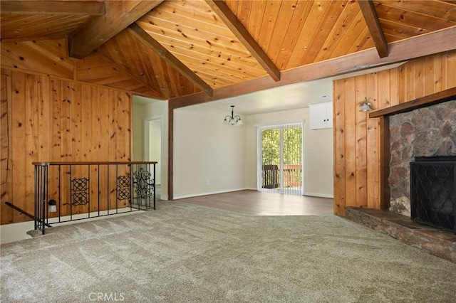 32296 Fern Dr, Running Springs, CA 92382 - unfurnished living room featuring carpet flooring, wood ceiling, a chandelier, baseboards, and a stone fireplace