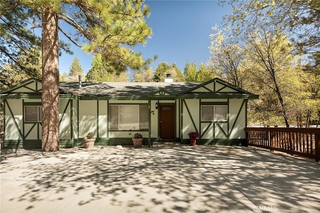 32296 Fern Dr, Running Springs, CA 92382 - tudor-style house with stucco siding