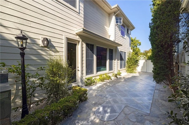 93 Old Course Dr, Newport Beach, CA 92660 - view of home's exterior with a patio area and a gate