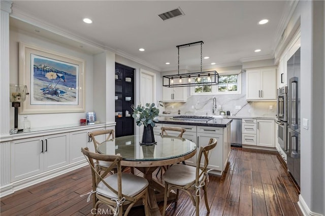 93 Old Course Dr, Newport Beach, CA 92660 - dining area featuring dark wood-type flooring, recessed lighting, and ornamental molding