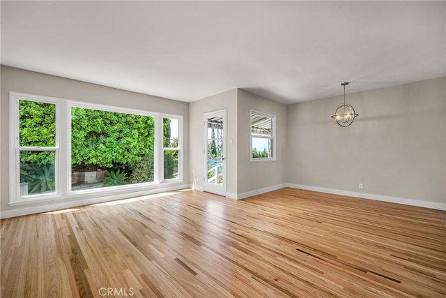 2607 Nearcliff St, Torrance, CA 90505 - unfurnished room with baseboards, a chandelier, and light wood finished floors