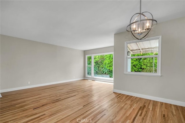 2607 Nearcliff St, Torrance, CA 90505 - empty room featuring a chandelier, baseboards, and light wood-style flooring