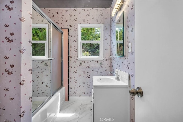 2607 Nearcliff St, Torrance, CA 90505 - bathroom featuring wallpapered walls, vanity, enclosed tub / shower combo, marble look tiles, and baseboards