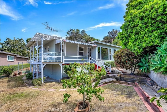 2607 Nearcliff St, Torrance, CA 90505 - back of house with stairway, stucco siding, and a pergola