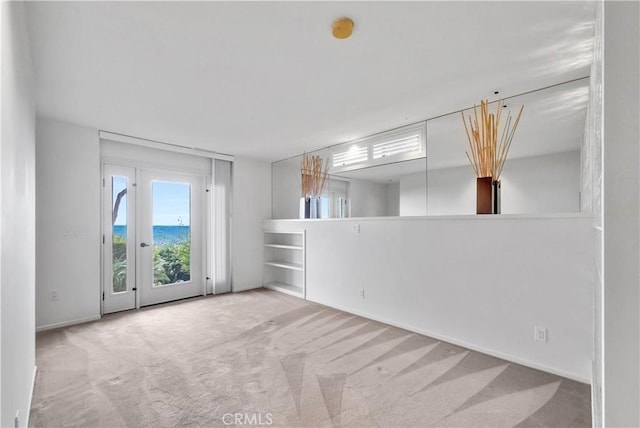 537 Dunnegan Pl, Laguna Beach, CA 92651 - empty room with carpet floors, a smoke detector, baseboards, and a water view