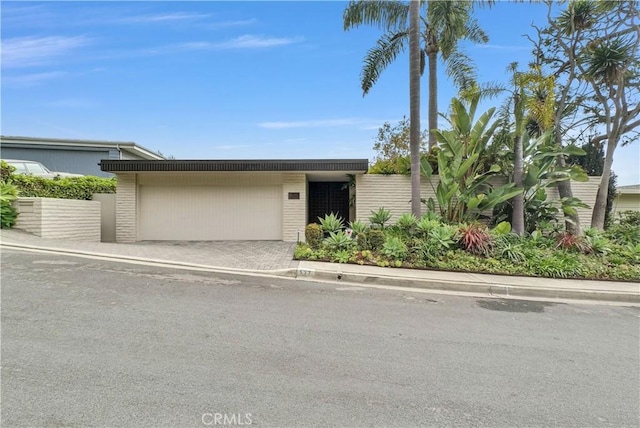 537 Dunnegan Pl, Laguna Beach, CA 92651 - mid-century inspired home with an attached garage and driveway