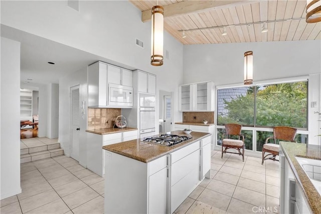 537 Dunnegan Pl, Laguna Beach, CA 92651 - kitchen with open shelves, stainless steel gas cooktop, wood ceiling with exposed beams, backsplash, and light tile patterned floors