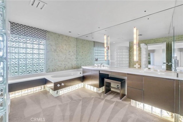537 Dunnegan Pl, Laguna Beach, CA 92651 - bathroom with double vanity, a garden tub, and wallpapered walls