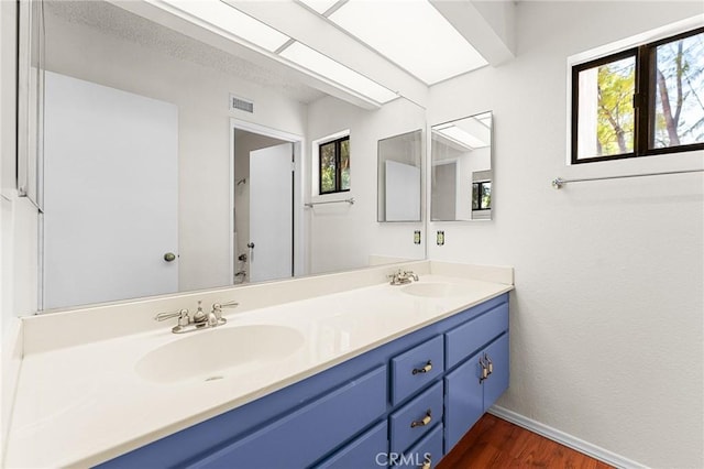 1234 Via Palermo, Redlands, CA 92374 - full bath with wood finished floors, double vanity, baseboards, and plenty of natural light