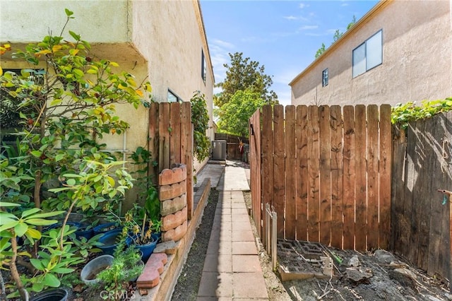 1234 Via Palermo, Redlands, CA 92374 - view of side of home featuring stucco siding and central AC