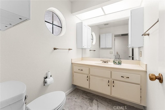 1234 Via Palermo, Redlands, CA 92374 - bathroom featuring toilet, marble finish floors, baseboards, and vanity