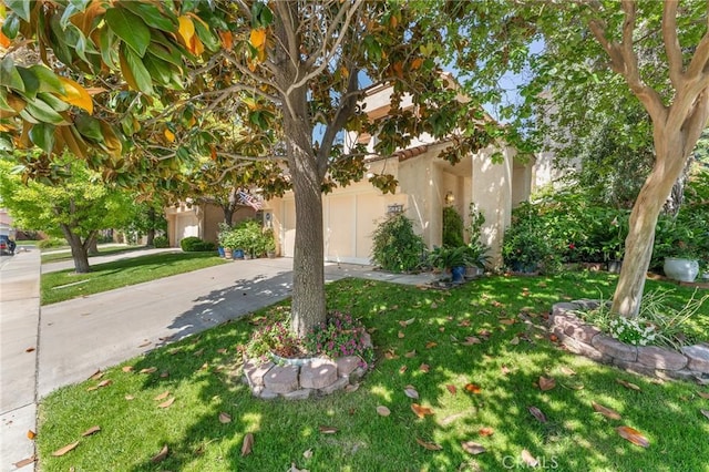 1234 Via Palermo, Redlands, CA 92374 - view of property exterior with driveway, a yard, an attached garage, and stucco siding