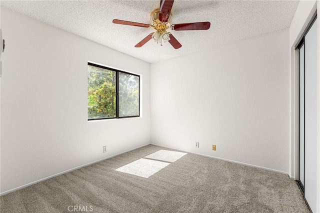 1234 Via Palermo, Redlands, CA 92374 - empty room with carpet floors, a textured ceiling, a ceiling fan, and baseboards