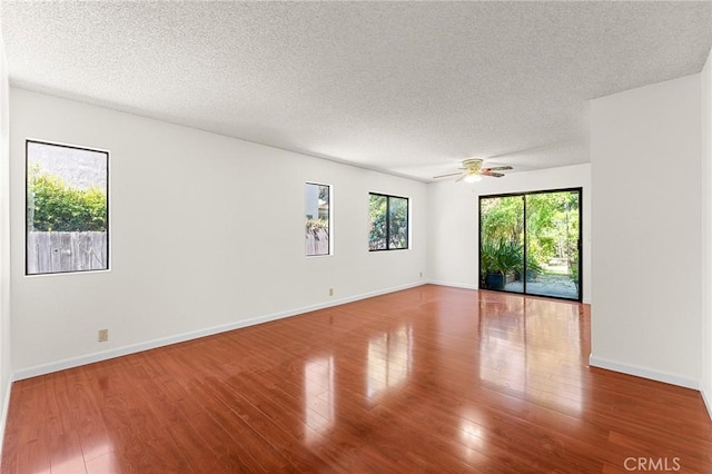 1234 Via Palermo, Redlands, CA 92374 - spare room with wood finished floors, a textured ceiling, a ceiling fan, and baseboards