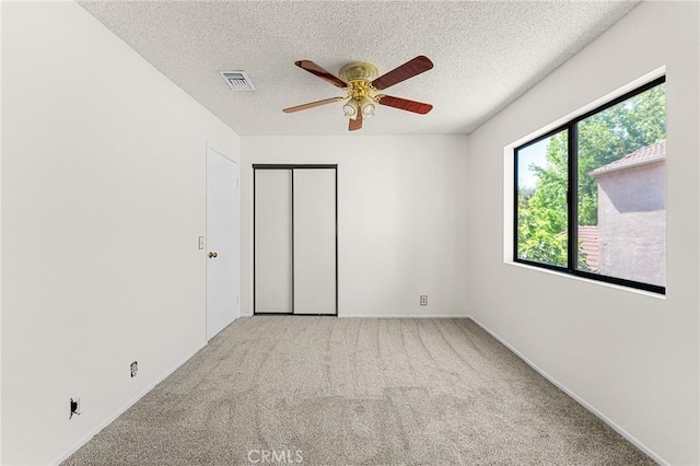 1234 Via Palermo, Redlands, CA 92374 - carpeted spare room with a ceiling fan, a textured ceiling, and baseboards