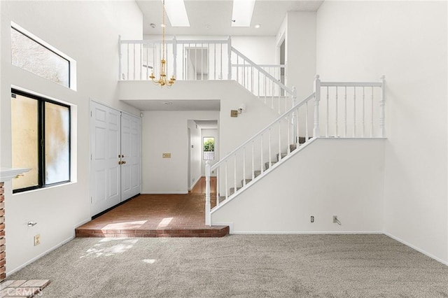 1234 Via Palermo, Redlands, CA 92374 - foyer featuring carpet, stairs, a chandelier, and a towering ceiling