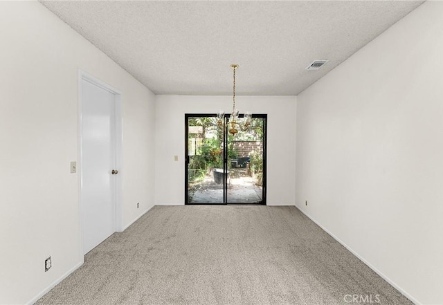 1234 Via Palermo, Redlands, CA 92374 - unfurnished dining area with a chandelier, carpet flooring, a textured ceiling, and baseboards