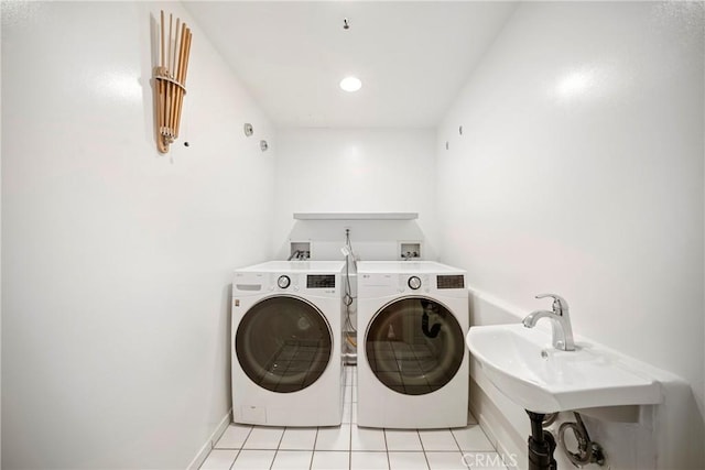 132 S Crescent Dr Unit 202, Beverly Hills, CA 90212 - laundry area with washer and clothes dryer, light tile patterned floors, and baseboards