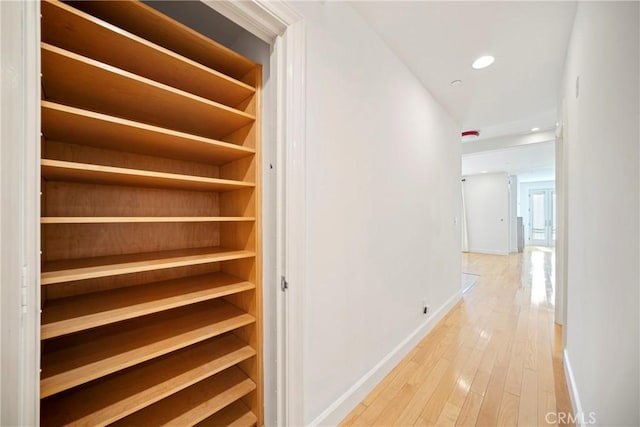 132 S Crescent Dr Unit 202, Beverly Hills, CA 90212 - corridor featuring baseboards, light wood-style floors, and recessed lighting