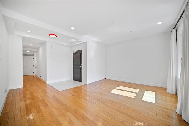 132 S Crescent Dr Unit 202, Beverly Hills, CA 90212 - unfurnished room featuring baseboards, light wood finished floors, and recessed lighting