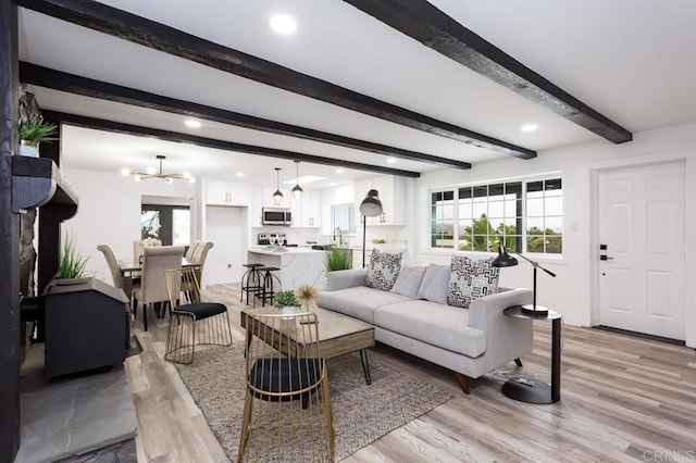 12049 Coping Pl, Lakeside, CA 92040 - living room with a chandelier, light wood-style flooring, beamed ceiling, recessed lighting, and baseboards