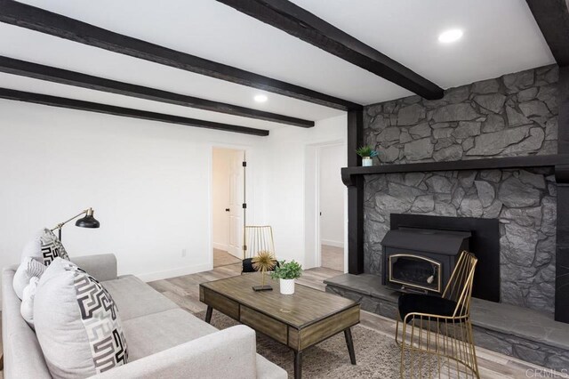 12049 Coping Pl, Lakeside, CA 92040 - living area with wood finished floors, beamed ceiling, and baseboards