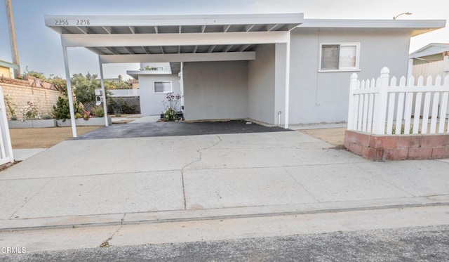 2256 Pierpont Blvd, Ventura, CA 93001 - view of front of home featuring a carport and stucco siding