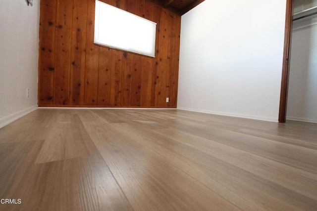2256 Pierpont Blvd, Ventura, CA 93001 - spare room featuring light wood-style flooring, wood walls, and baseboards