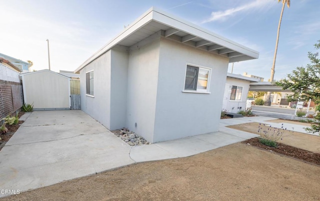 2256 Pierpont Blvd, Ventura, CA 93001 - view of property exterior featuring stucco siding, a patio, and an outbuilding