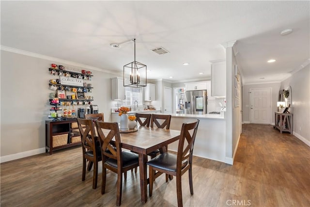 13009 Cerritos Ct, Hesperia, CA 92344 - dining space with crown molding, wood finished floors, baseboards, and recessed lighting