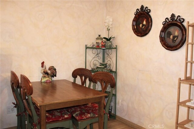 5325 Lindley Ave Unit 202, Tarzana, CA 91356 - dining room featuring wood finished floors