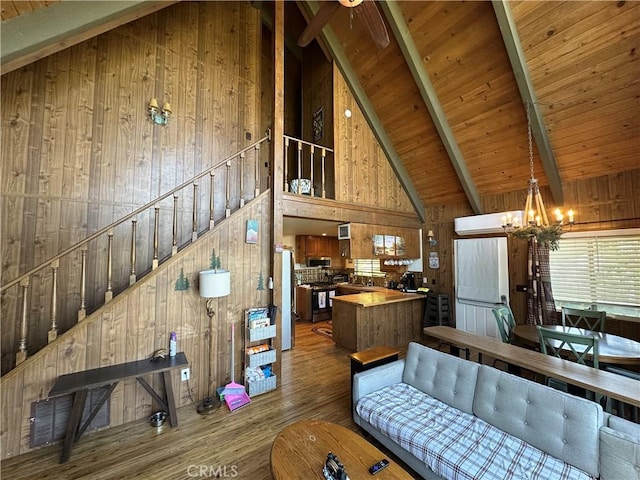 1286 Aleutian Dr, Lake Arrowhead, CA 92352 - living area with wooden walls, high vaulted ceiling, wood finished floors, a chandelier, and wood ceiling with exposed beams