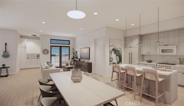 581 Higuera St Unit 208, San Luis Obispo, CA 93401 - dining area with recessed lighting, light wood-style flooring, and baseboards