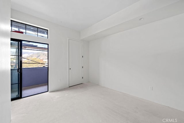 581 Higuera St Unit 208, San Luis Obispo, CA 93401 - unfurnished room featuring plenty of natural light and concrete flooring