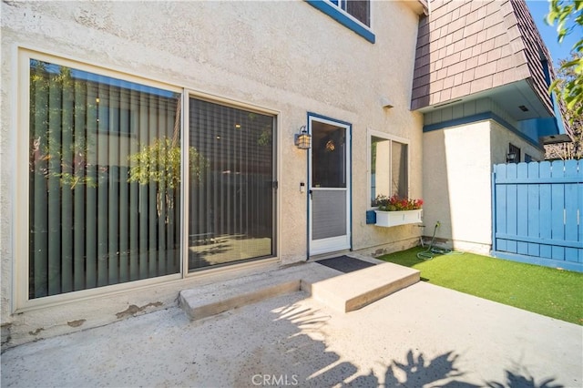 420 N Jeanine Dr Unit C, Anaheim, CA 92806 - property entrance with stucco siding, a patio area, and mansard roof