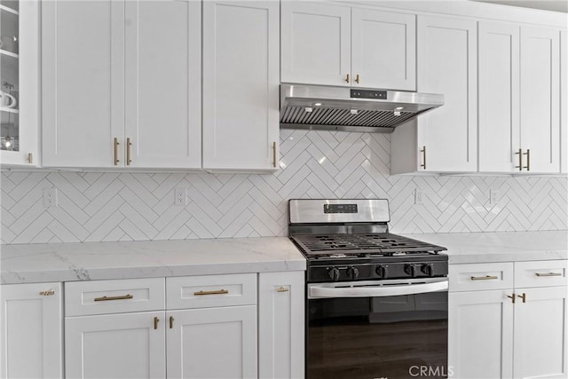 8798 Crest View Dr, Corona, CA 92883 - kitchen with stainless steel range with gas cooktop, under cabinet range hood, white cabinetry, and glass insert cabinets