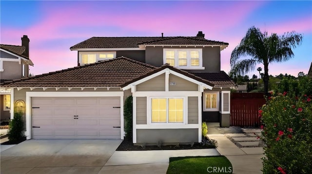 8798 Crest View Dr, Corona, CA 92883 - view of front facade featuring a tile roof, concrete driveway, an attached garage, a chimney, and stucco siding