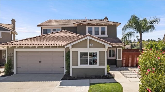 8798 Crest View Dr, Corona, CA 92883 - view of front of property featuring a tiled roof, an attached garage, driveway, a chimney, and stucco siding