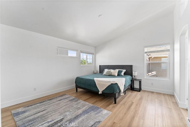 8798 Crest View Dr, Corona, CA 92883 - bedroom with light wood finished floors, vaulted ceiling, and baseboards