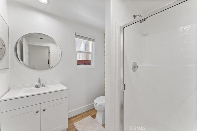 8798 Crest View Dr, Corona, CA 92883 - bathroom with a shower stall, toilet, vanity, wood finished floors, and baseboards