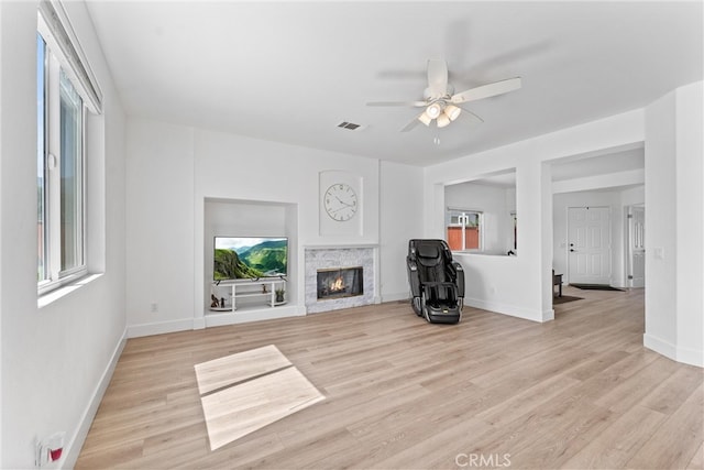 8798 Crest View Dr, Corona, CA 92883 - unfurnished living room with healthy amount of natural light, ceiling fan, and light wood finished floors