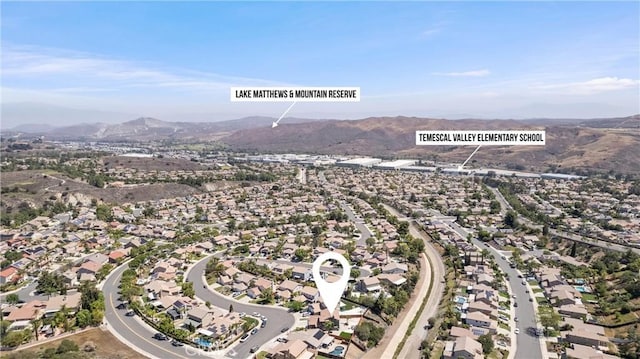 8798 Crest View Dr, Corona, CA 92883 - aerial view of property's location with a mountainous background and nearby suburban area