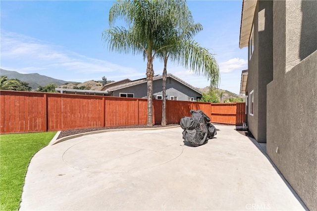 8798 Crest View Dr, Corona, CA 92883 - fenced backyard with a patio area and a mountain view