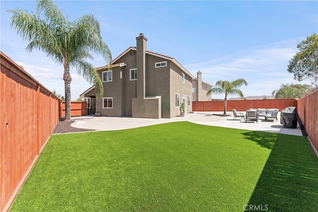 8798 Crest View Dr, Corona, CA 92883 - rear view of house featuring stucco siding, a patio, an outdoor living space, and a chimney
