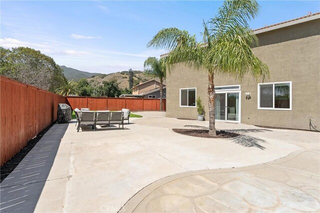 8798 Crest View Dr, Corona, CA 92883 - fenced backyard featuring a mountain view and a patio area